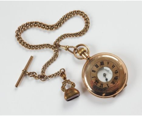 WATCH & CHAIN. A gold-plated, half hunter pocket watch in English case by W.E. Ltd., the movement numbered 615498. Hung on a 