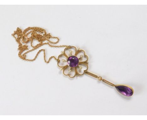 AMETHYST PENDANT. A Victorian 15ct. gold amethyst & seed pearl pendant. Length of pendant & drop, 6cm.  Please note that all 