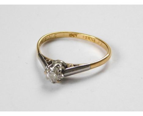 DIAMOND RING. An 18ct. gold & platinum solitaire diamond ring. The stone of approx. 0.20ct. spread. Size K.  Please note that