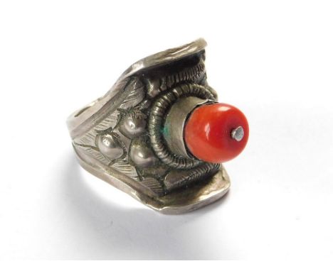 VINTAGE SADDLE RING. A Tibetan, white metal, coral-set saddle ring. Size R/S.  Please note that all items in this auction are