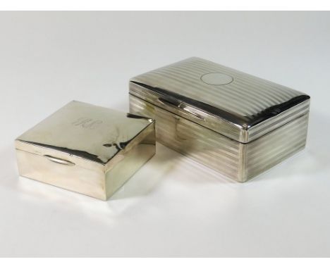 CIGARETTE BOXES. An early 20th century, engine turned cigarette box. 14 x 9 x 5cm. London 1910. Also, a smaller cigarette box