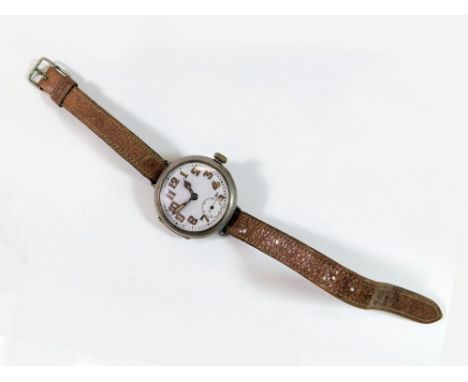 ROLEX WRISTWATCH. A WWI officer's silver cased Rolex trench wristwatch. The white enamel dial with luminous Arabic numerals, 