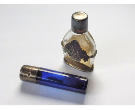 SCENT BOTTLES. A blue glass silver mounted scent bottle (Lacks stopper). Length 6.5cm. Also, an 830 standard silver overlay &