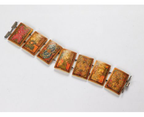 PERSIAN BRACELET. A Persian bone bracelet, each plaque finely painted with floral designs, three painted with figures. Size o