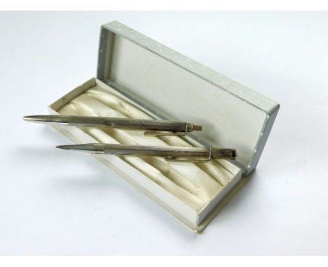 PEN/PENCIL SET. An engine turned silver ball pen & matching propelling pencil, in fitted box.  Please note that all items in 