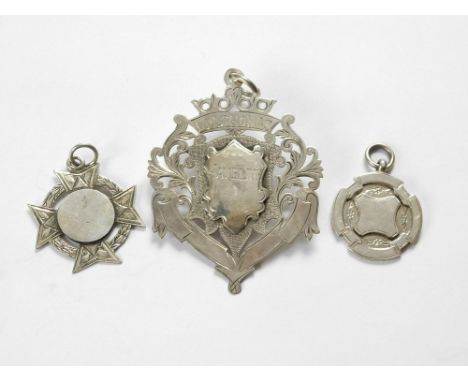 SILVER FOBS ETC. Two silver watch chain fobs & a large silver presentation fob presented to Cpl. Thomas for 'Javeline'.  Plea