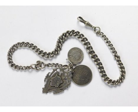 WATCH CHAIN ETC. A graduated silver curb link watch chain hung with an Edwardian silver watch chain fob & two 19th century co