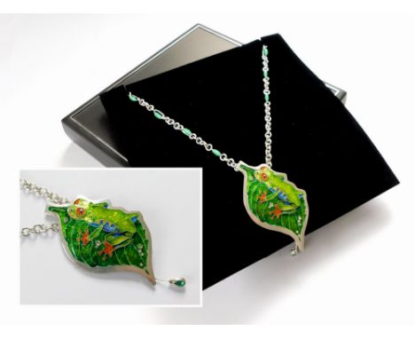 JAMES & SAMANTHA SUDDABY. A contemporary, hand made 999 fine silver 'Tree Frog on a Leaf' pendant hung on a 999 fine silver h