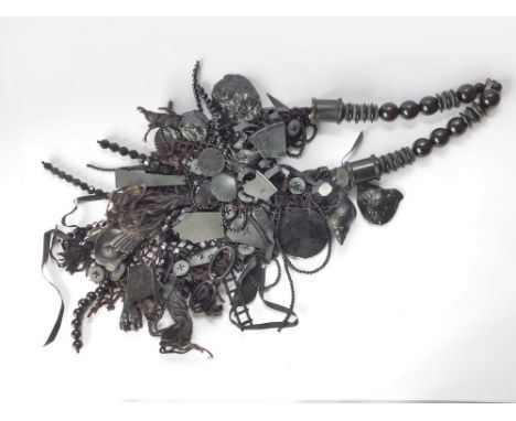 JUDY BLAME. A 1980's punk neckpiece by Judy Blame, comprising a macrame foundation, then covered with assorted black items in