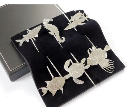 JAMES SUDDABY A contemporary, hand made set of James Suddaby, Newlyn 999 fine silver 'Newlyn Fish' olive picks, each finial r
