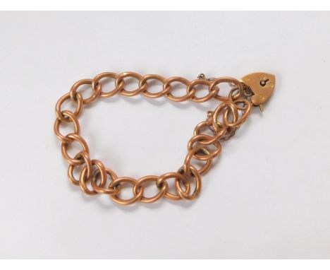 GOLD BRACELET. A 9ct. rose gold bracelet with padlock clasp. Approx. 7.2g.  Please note that all items in this auction are pr