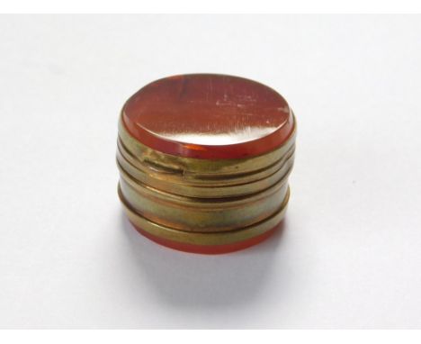 SNUFF BOX. A late 19th century brass mounted agate snuff box.  Please note that all items in this auction are previously owne