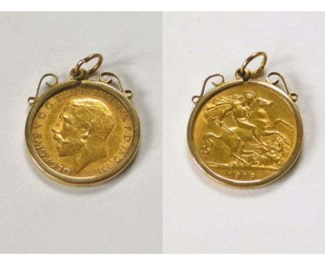 COIN PENDANT. A George V 1913 half sovereign in 9ct. gold pendant mount.  Please note that all items in this auction are prev