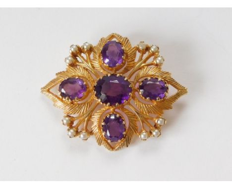 GOLD BROOCH. A gold brooch set with four oval amethysts of good colour & 12 half pearls. Width 5cm. Approx. 17.4g.  Please no