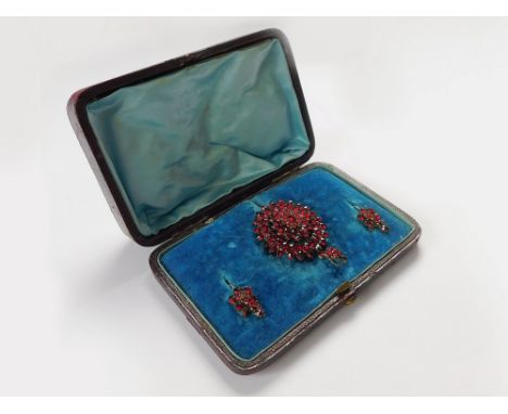 BOHEMIAN GARNETS. A 19th century Bohemian garnet-set pendant/brooch with matching earrings in original fitted case. Length of