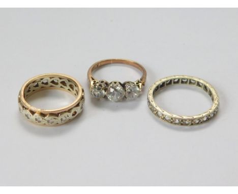 GOLD RINGS. Two 9ct. gold paste set eternity rings & a 9ct. gold, three-stone paste set ring (shoulder/shank with split). Gro