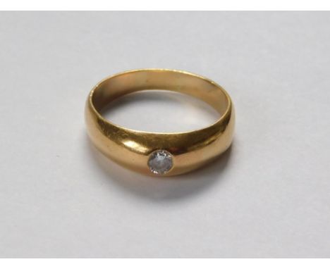 GOLD RING. An unstamped (probably 18ct. gold) yellow metal ring, set an old cut solitaire diamond of approx. 0.05ct. spread. 