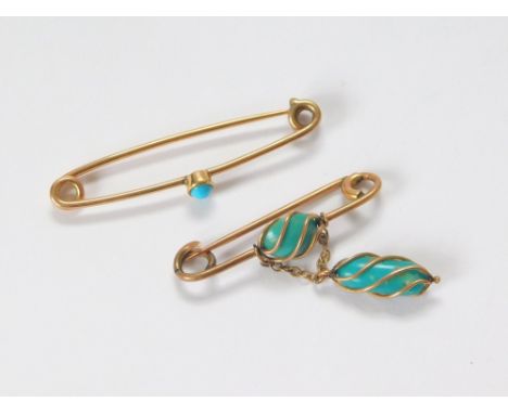 BAR BROOCHES. Two turquoise set bar brooches, set in unmarked yellow metal.  Please note that all items in this auction are p