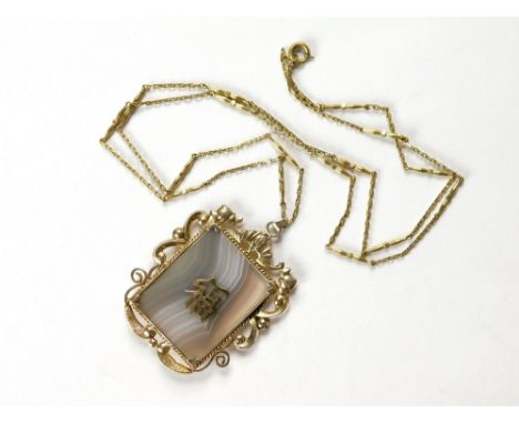 CHINESE PENDANT. A Chinese banded agate pendant set in gilt metal & hung on a gilt metal chain. Pendant size 4.8 x 3.8cm.  Pl