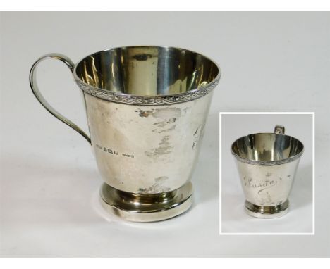 CHRISTENING MUG. An early 1940s christening mug with Celtic strap work style border & engraved 'Susan'. Height 7.2cm. Approx.