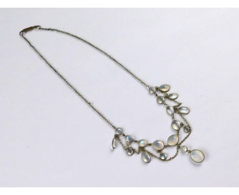 MOONSTONE NECKLACE. A blue moonstone necklace set with various oval & round stones, in a festoon style. Length 37cm.  Please 