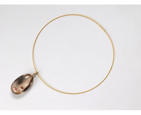 QUARTZ PENDANT. A Golden Rutilate quartz pendant hung on an 18ct. gold hand made suspension loop. Fully stamped & with the sp