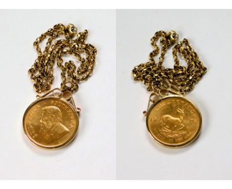 GOLD COIN PENDANT. A 1975 South African Krugerrand 1oz. fine gold coin, loose mounted in a 9ct. gold pendant mount on 9ct. go