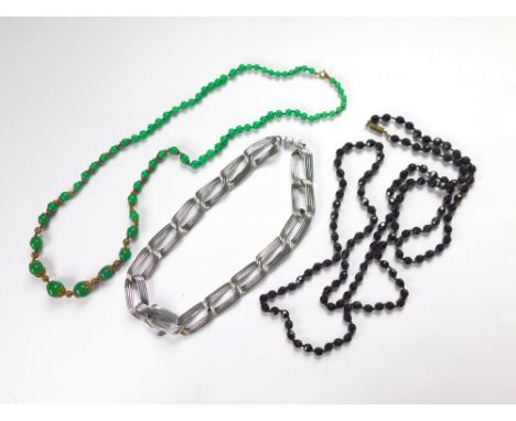 COSTUME JEWELLERY. A chromium plated necklace & two vintage necklaces in black & green glass.  Please note that all items in 