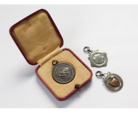 MEDAL ETC. A Royal Lifesaving Society medal, awarded July 1926, in fitted case. Also, two silver fobs for swimming.  Please n