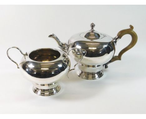 TEAPOT ETC. A 1920s silver teapot by Lawrence Emanuel. Birmingham 1924. Also a matching sugar bowl (no cream jug). Gross weig