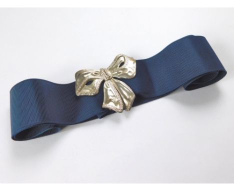 NURSES BUCKLE. A modern silver hallmarked nurses buckle, cast as a large bow. Max. width 8cm.  Please note that all items in 