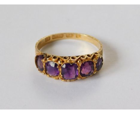 AMETHYST RING. A Victorian 15ct. gold amethyst set ring. Birmingham 1873. Size M. (Slight loss of metal setting around one en