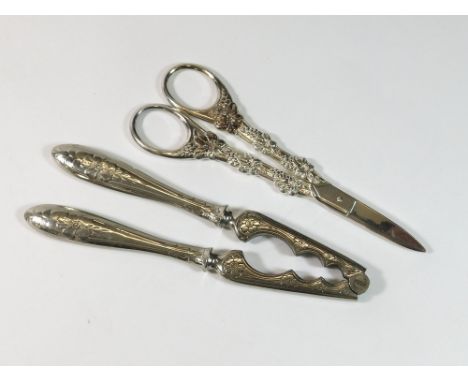 GRAPE SCISSORS ETC. A pair of silver plated grape scissors & a pair of Norwegian, silver plated nut crackers.  Please note th