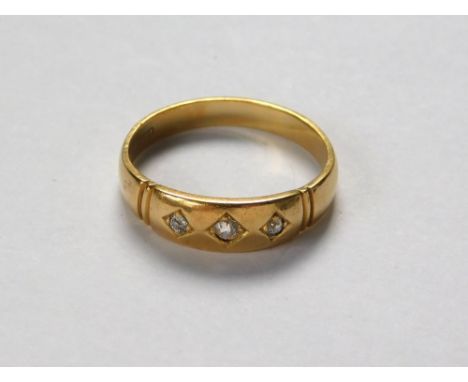 GOLD RING. A 19th century 18ct. gold, three stone diamond ring. Approx. 3.8g. Size N.  Please note that all items in this auc