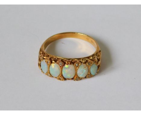 OPAL RING. A Victorian style, 18ct. gold opal & diamond set ring. London 1975. Size P/Q.  Please note that all items in this 