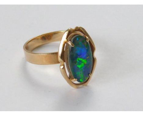 OPAL RING. A 9ct. gold opal doublet ring. Size O.  Please note that all items in this auction are previously owned & are offe