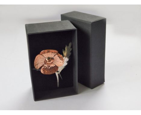 JAMES SUDDABY. A contemporary, hand made 'Poppy For Remembrance' brooch, in copper & 925 silver, set a small Colombian emeral