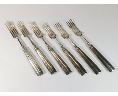 TABLE FORKS. A set of four early 19th century table forks by Moses Brent with reeded handles. Also, a matched pair of forks b