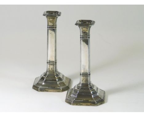 SILVER CANDLESTICKS. A pair of early 20th century silver candlesticks by Harrison Brothers & Howson. Sheffield 1911. Height 1