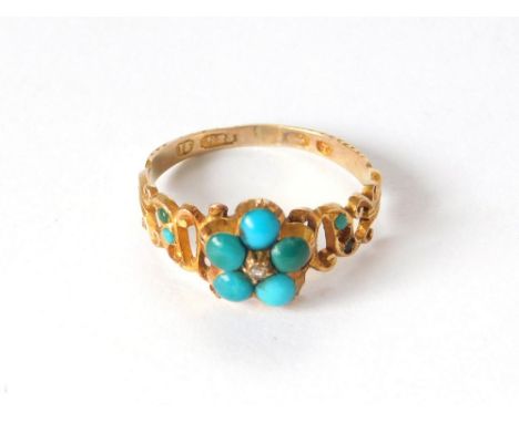 VICTORIAN RING. A Victorian 15ct. gold, turquoise set ring, at the centre, a small native cut diamond. (One small stone missi