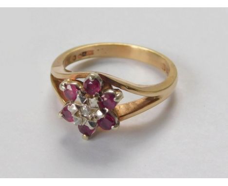 GOLD RING. A 9ct. gold dress ring, cluster set with rubies & an illusion diamond. Size N.  Please note that all items in this