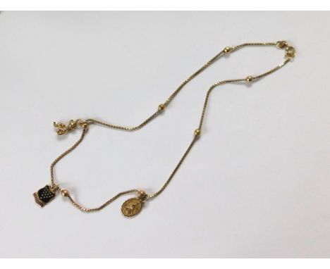 GOLD NECKLACE. A 9k. box link & bead necklace, hung with three 9ct. gold charms. Approx. 8.5g.  Please note that all items in