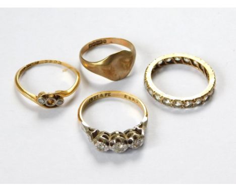 GOLD RINGS. An 18ct. gold & platinum, illusion set, three stone diamond ring, an 18ct. gold & platinum three stone diamond ri