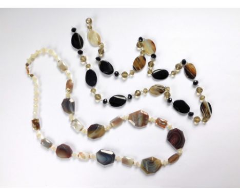 AGATE NECKLACES. Two agate bead long necklaces, one of angular beads, strung with white labradorite, the other with black ony