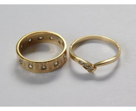 GOLD RINGS. A 9ct. gold full hoop eternity ring & a 14ct. gold dress ring, both set with white stones.  Please note that all 