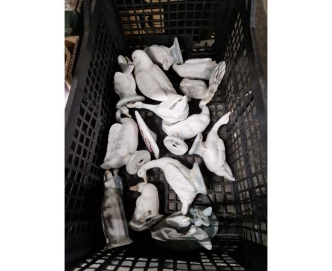 A box containing 14 Nao figures, mainly geese, but also includes a dove and a name plaque.&nbsp;Condition - good, all pieces 