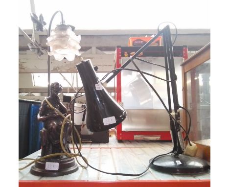 A figural lamp and an anglepoise lamp. 