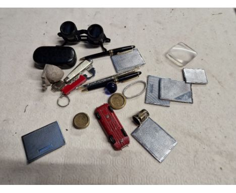 A tub of mixed collectables including stamp cases, pens, penknives, Avery weights, binocular glasses, etc. 