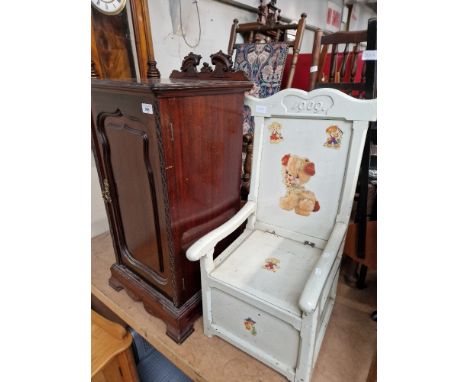 A bedside cabinet, a rocking chair, a rush seated chair and a child's commode chair.