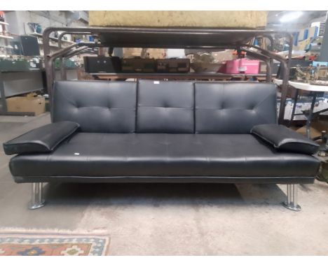 A chrome and faux leather sofa bed. 